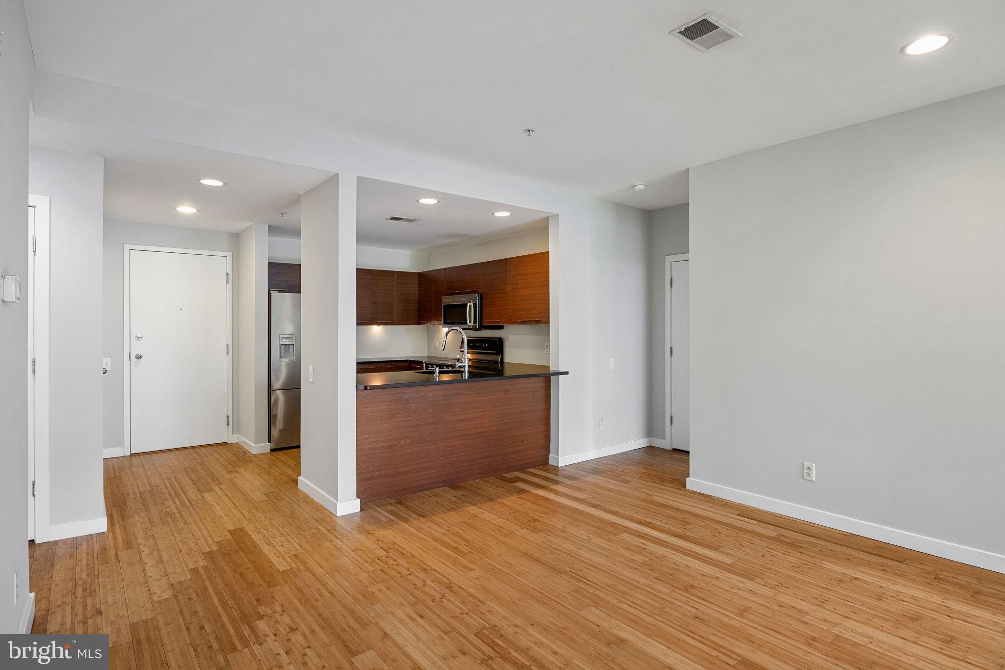 934 North 3rd Street, Unit 205 Philadelphia, PA 19123 - Photo 8 of 39 a view of kitchen with wooden floor