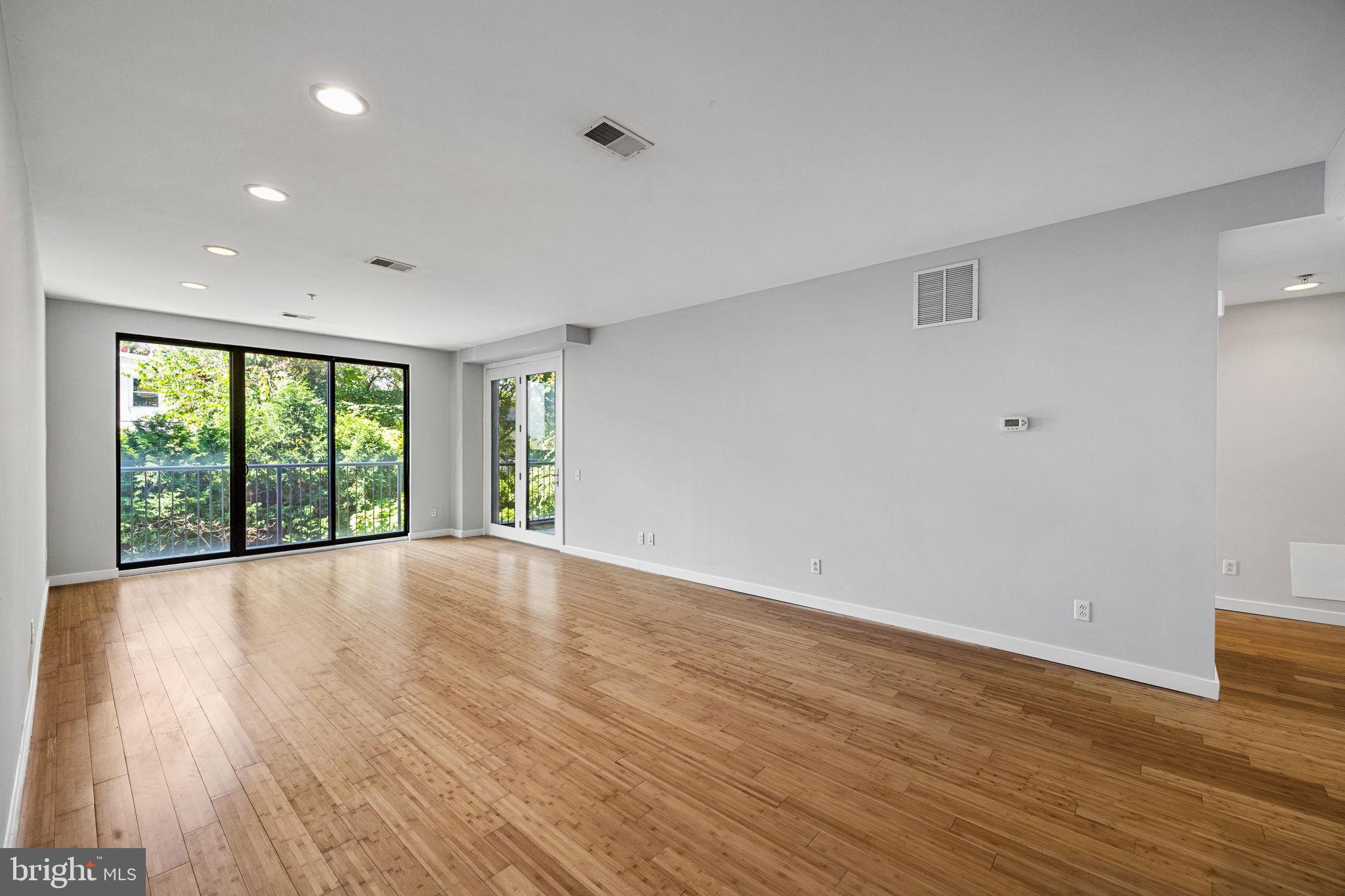 934 North 3rd Street, Unit 205 Philadelphia, PA 19123 - Photo 9 of 39 a view of an empty room with wooden floor and a window