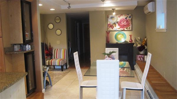 53 Corey Street, Unit B Everett, MA 02149 - Photo 11 of 30 a living room with furniture and a flat screen tv