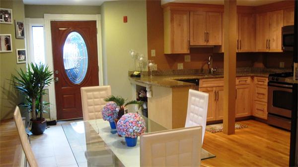 53 Corey Street, Unit B Everett, MA 02149 - Photo 13 of 30 a kitchen with stainless steel appliances granite countertop a stove a sink and a refrigerator