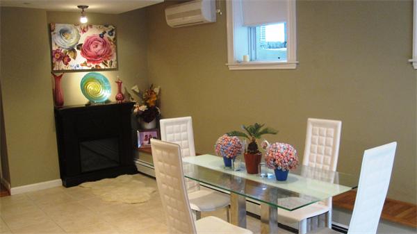53 Corey Street, Unit B Everett, MA 02149 - Photo 14 of 30 a dining room with furniture and a potted plant