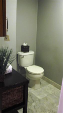 53 Corey Street, Unit B Everett, MA 02149 - Photo 16 of 30 a white toilet sitting next to a bathroom sink