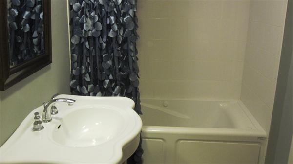 53 Corey Street, Unit B Everett, MA 02149 - Photo 17 of 30 a bathroom with a sink and a toilet