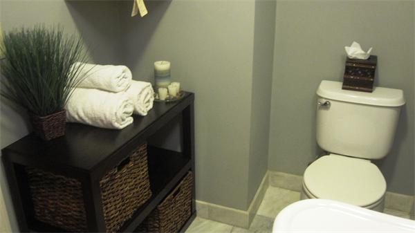 53 Corey Street, Unit B Everett, MA 02149 - Photo 18 of 30 a bathroom with a toilet sink and mirror