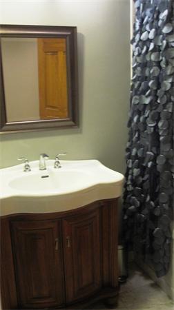 53 Corey Street, Unit B Everett, MA 02149 - Photo 19 of 30 a bathroom with a sink and a mirror