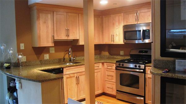 53 Corey Street, Unit B Everett, MA 02149 - Photo 2 of 30 a kitchen with stainless steel appliances granite countertop a stove a sink and a microwave
