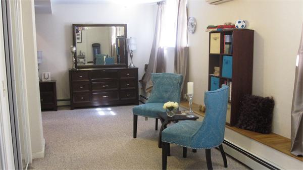 53 Corey Street, Unit B Everett, MA 02149 - Photo 22 of 30 a living room with furniture and a mirror