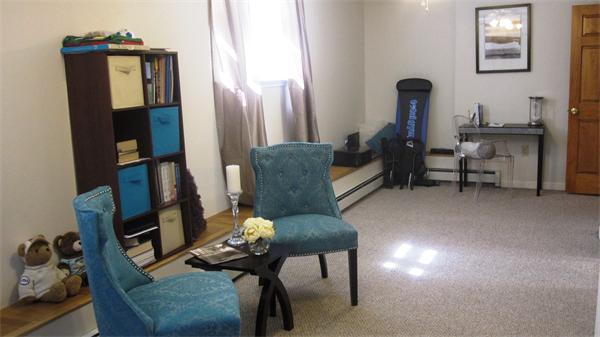53 Corey Street, Unit B Everett, MA 02149 - Photo 23 of 30 a living room with furniture and a mirror