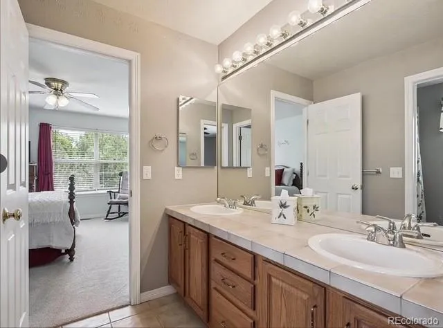 a bed room with a bed and a chair