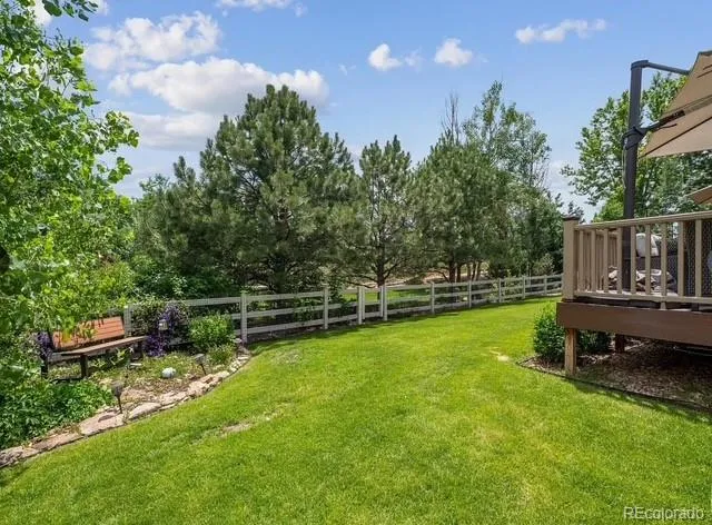 a view of sitting area with furniture and umbrella