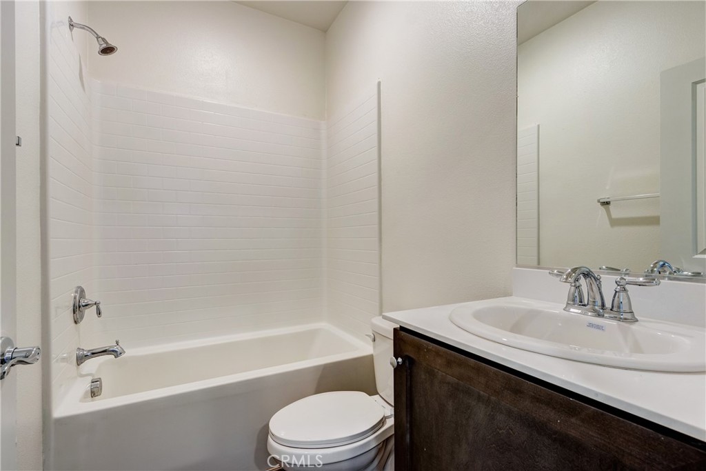 28295 Memory Lane Winchester, CA 92596 - Photo 13 of 68 a bathroom with a sink a toilet and shower