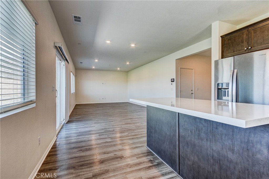 28295 Memory Lane Winchester, CA 92596 - Photo 22 of 68 a view of a hallway with wooden floor