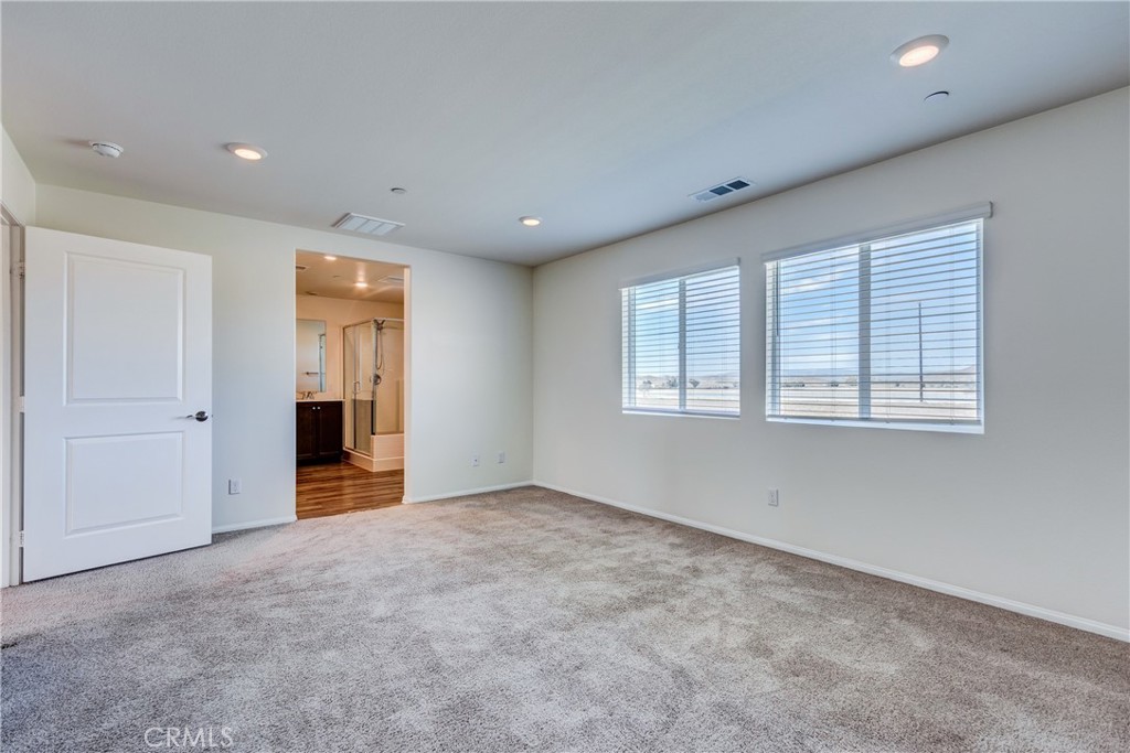 28295 Memory Lane Winchester, CA 92596 - Photo 28 of 68 an empty room with windows and closet