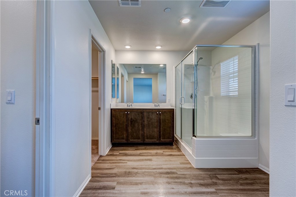 28295 Memory Lane Winchester, CA 92596 - Photo 30 of 68 a view of hallway with granite countertop a rug and a window