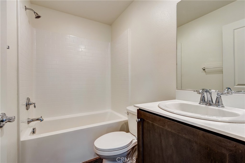 28295 Memory Lane Winchester, CA 92596 - Photo 34 of 68 a bathroom with a sink a toilet and bathtub