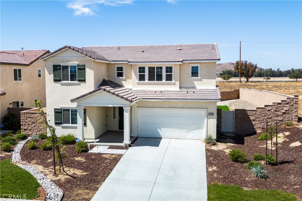 28295 Memory Lane Winchester, CA 92596 - Photo 53 of 68 a front view of a house with garden