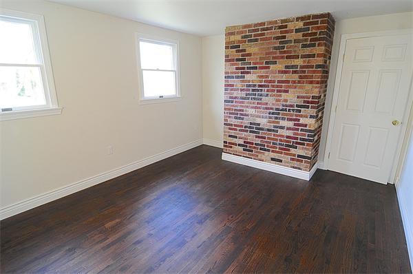 96 Adams Road Grafton, MA 01536 - Photo 14 of 24 an empty room with wooden floor and windows