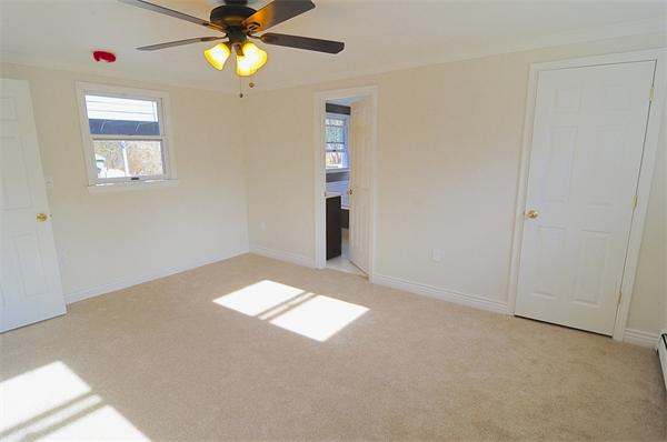 96 Adams Road Grafton, MA 01536 - Photo 15 of 24 a view of an empty room with a window