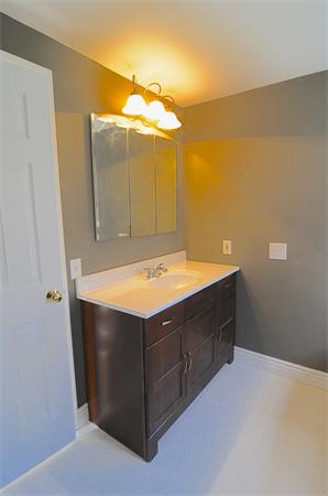 96 Adams Road Grafton, MA 01536 - Photo 16 of 24 a bathroom with a sink vanity and a mirror