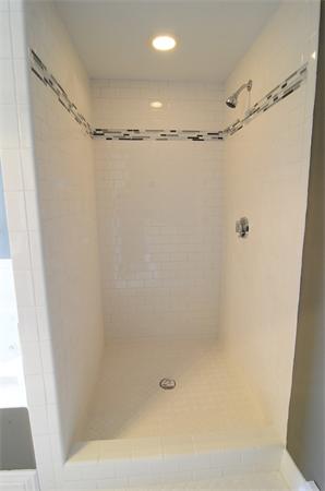 96 Adams Road Grafton, MA 01536 - Photo 19 of 24 a bathroom with a glass shower door