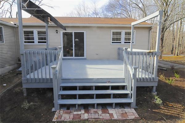 96 Adams Road Grafton, MA 01536 - Photo 24 of 24 a front view of a house with a balcony