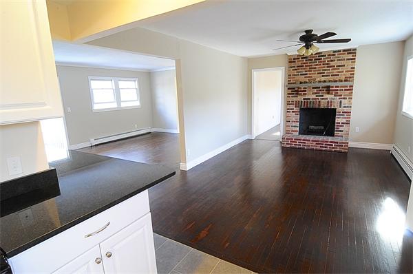 96 Adams Road Grafton, MA 01536 - Photo 7 of 24 a view of an empty room with window and wooden floor
