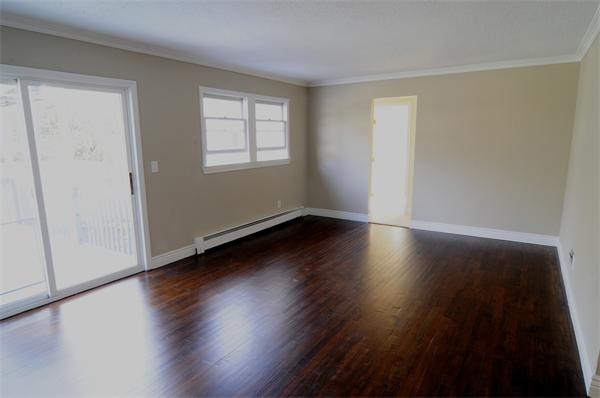 96 Adams Road Grafton, MA 01536 - Photo 9 of 24 a view of room with hardwood floor and window