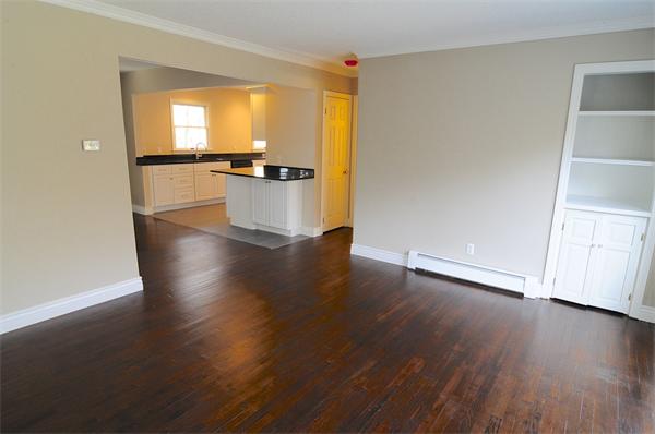 96 Adams Road Grafton, MA 01536 - Photo 10 of 24 a view of a kitchen with wooden floor and a window