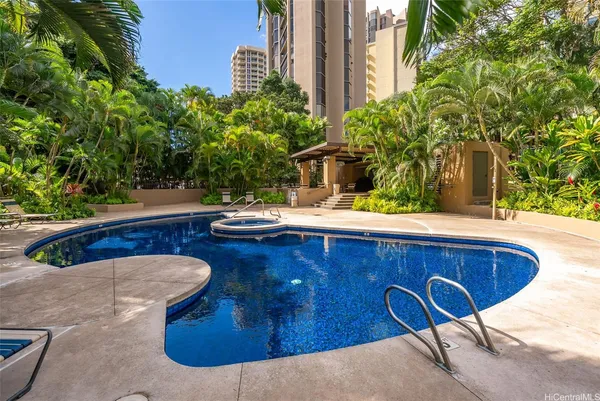a view of a swimming pool with a patio