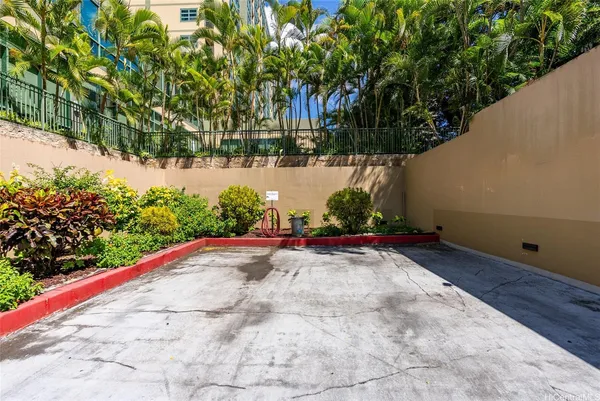 a view of a swimming pool with a patio and a yard