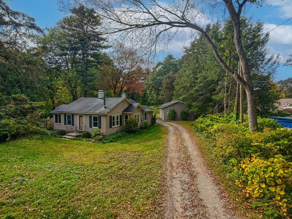 763 Stony Hill Road Wilbraham, MA 01095 - Photo 28 of 30 a view of a house with a big yard plants and large trees