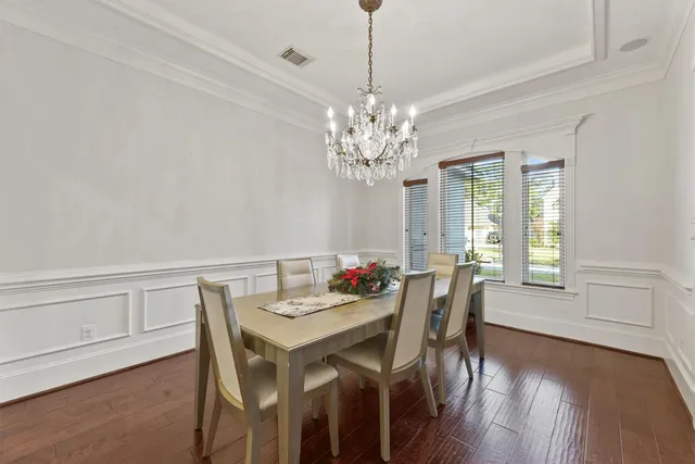 a large kitchen with kitchen island granite countertop a large island in the center and stainless steel appliances