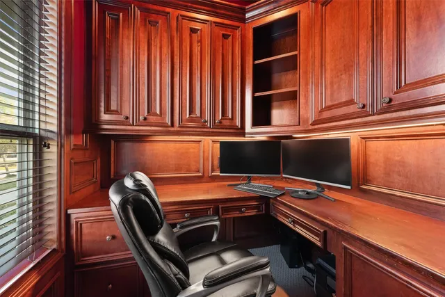 a bathroom with a granite countertop sink a toilet and a mirror