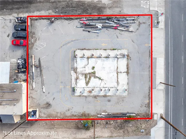 a view of a terrace with lawn chairs