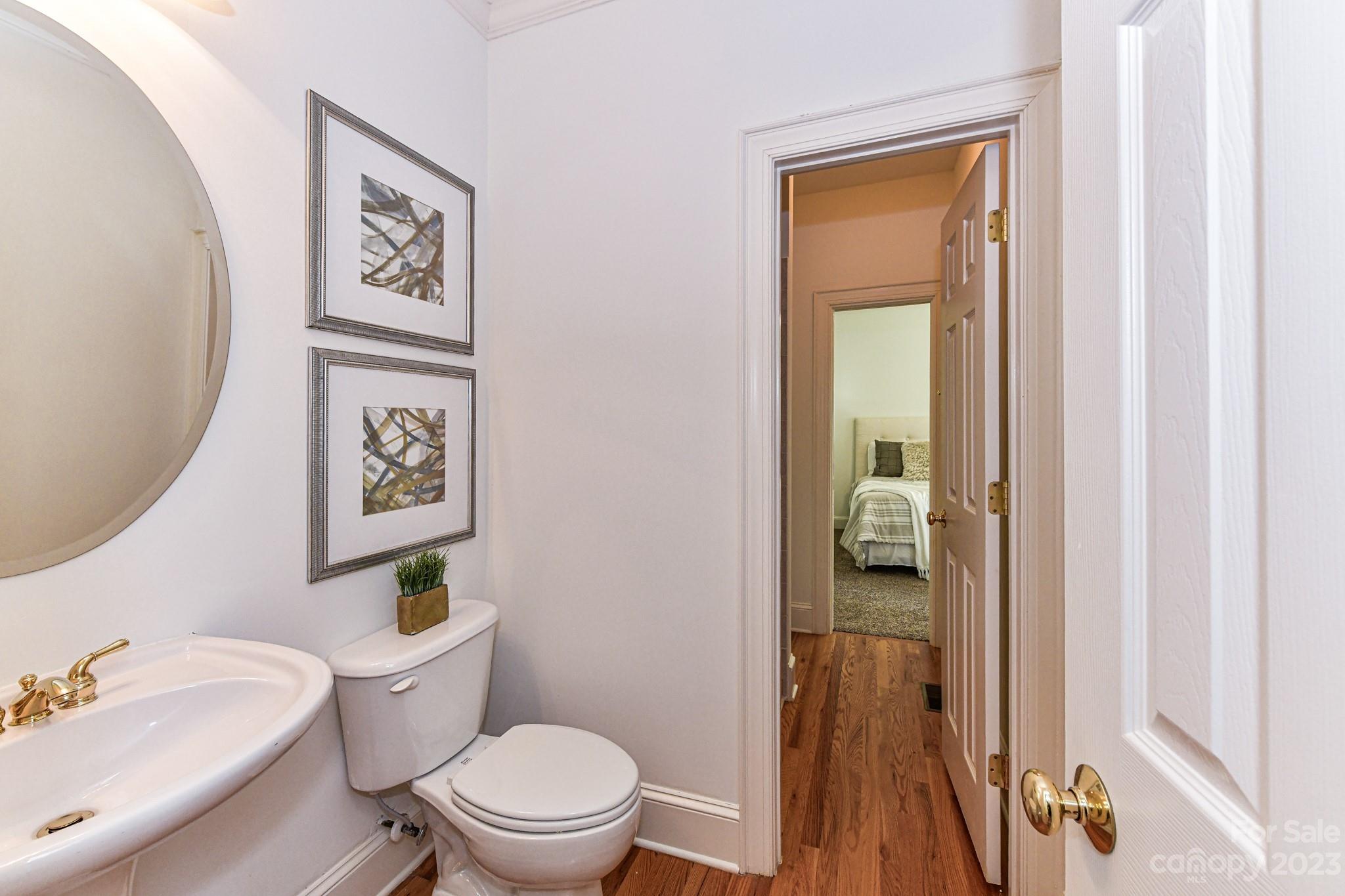 4030 Fawn Hill Road Matthews, NC 28105 - Photo 17 of 48 a white toilet sitting next to a bathroom sink