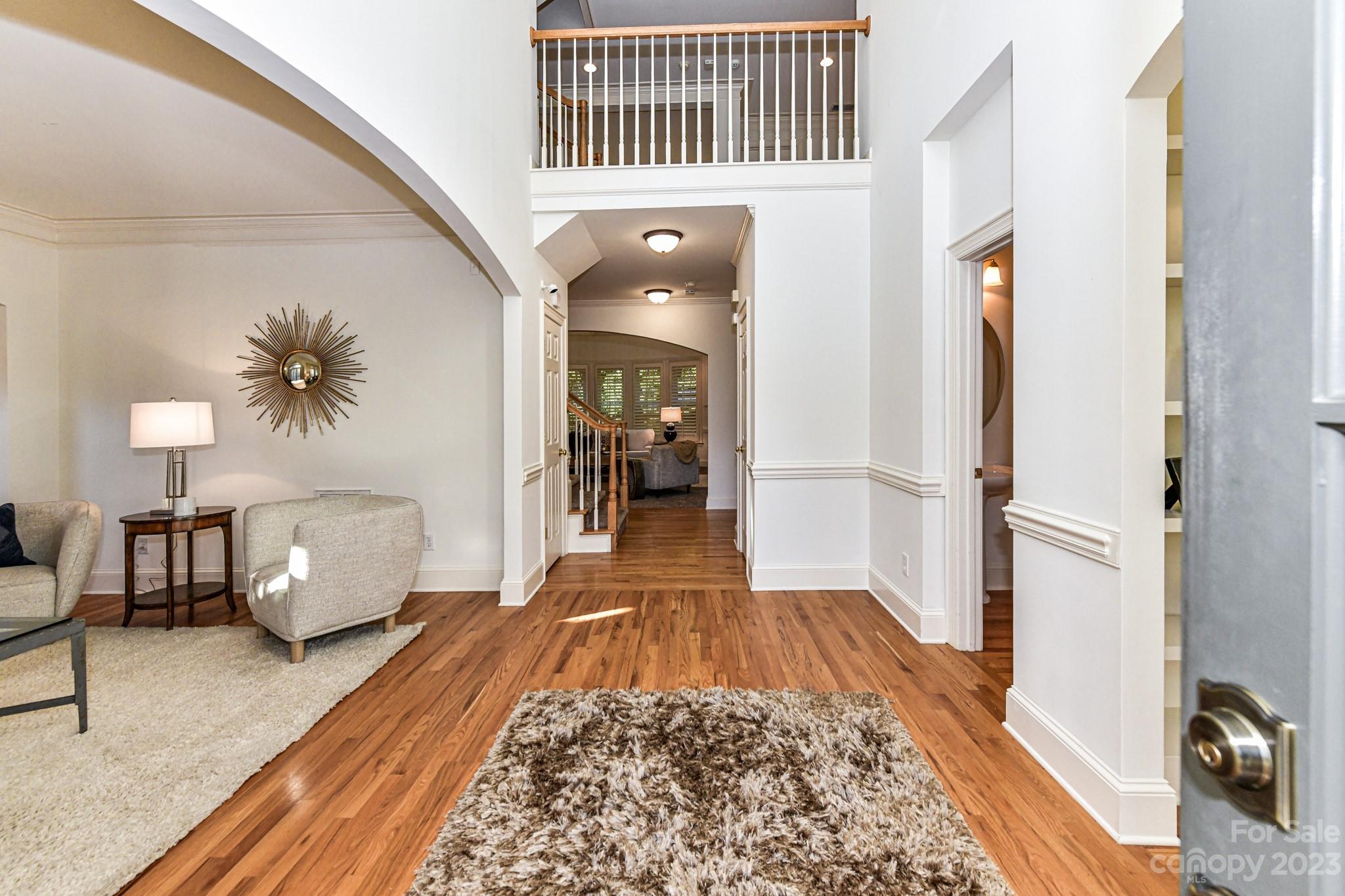 4030 Fawn Hill Road Matthews, NC 28105 - Photo 2 of 48 a hallway with a couch and a coffee table