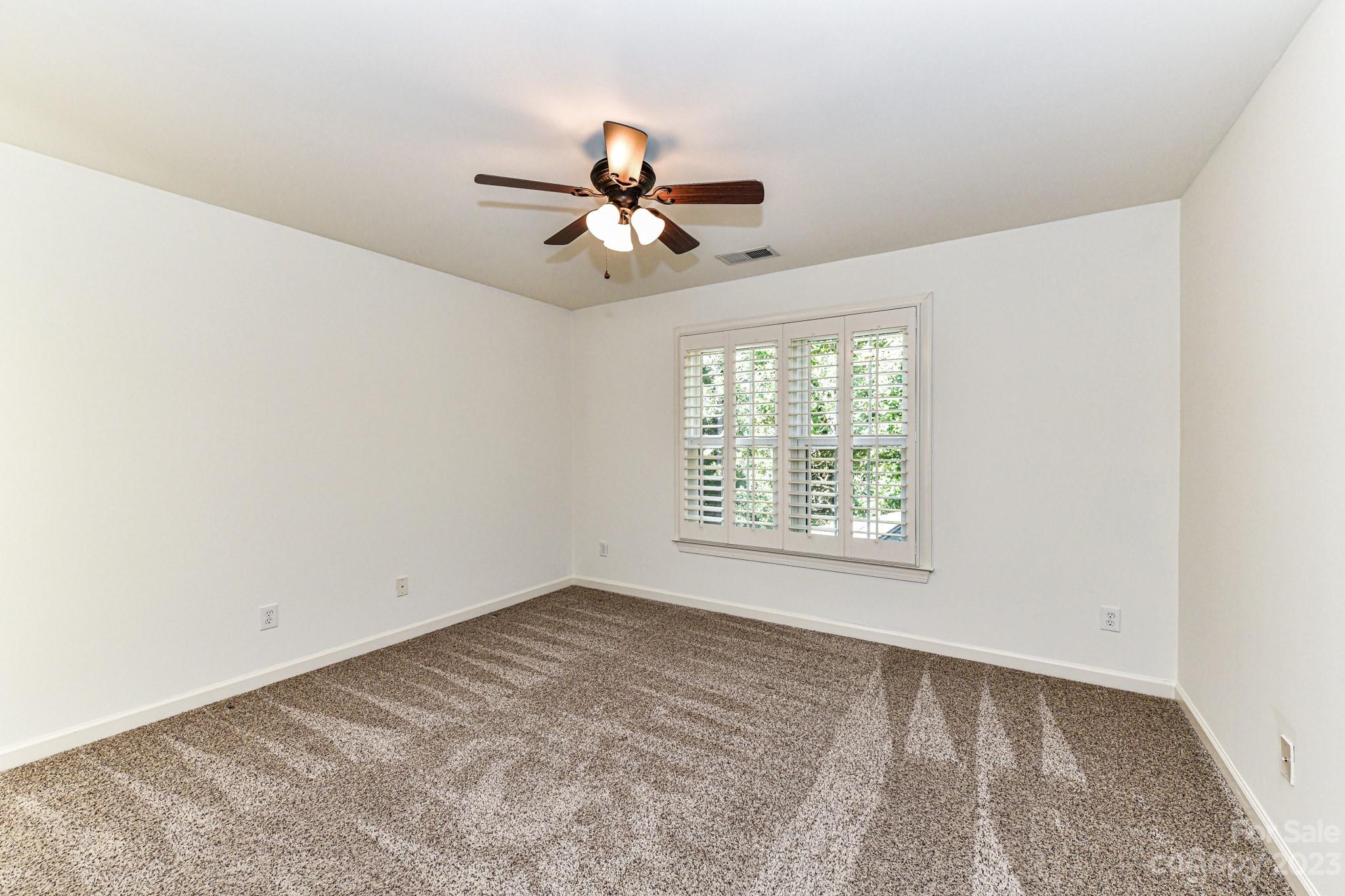 4030 Fawn Hill Road Matthews, NC 28105 - Photo 26 of 48 a view of a room with a ceiling fan and window