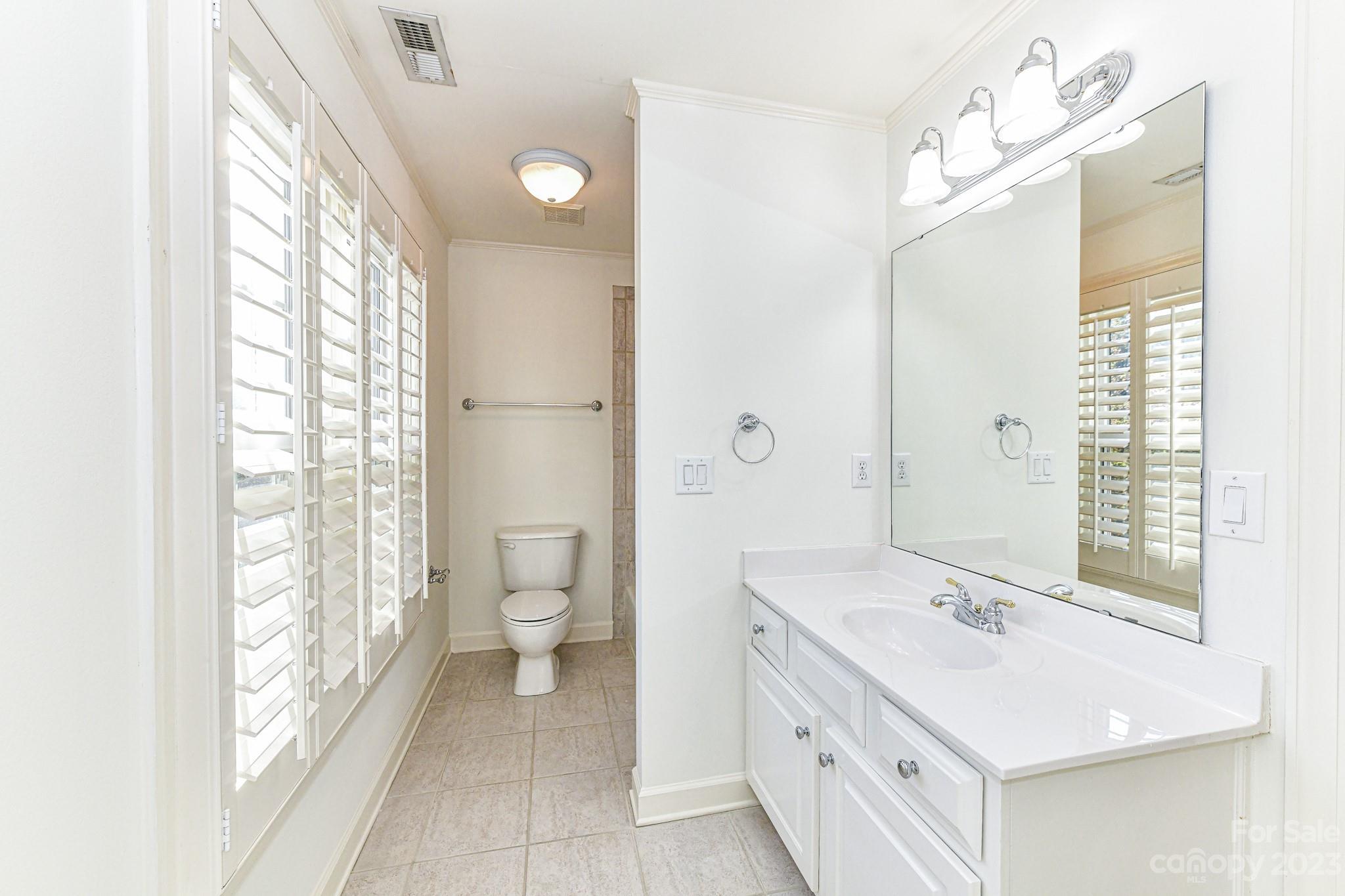 4030 Fawn Hill Road Matthews, NC 28105 - Photo 29 of 48 a bathroom with a double vanity sink toilet and shower