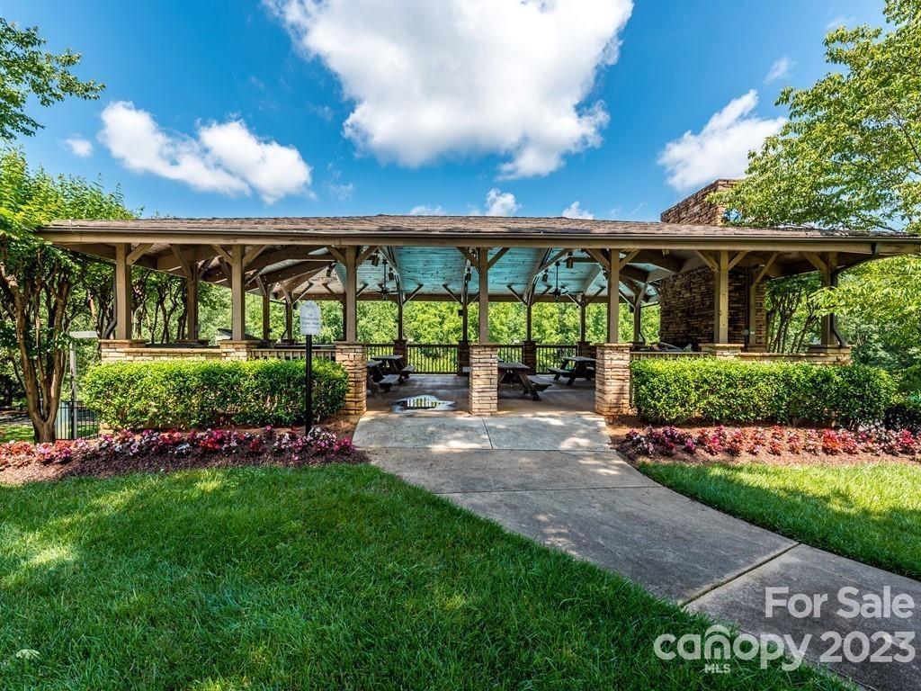 4030 Fawn Hill Road Matthews, NC 28105 - Photo 43 of 48 a view of swimming pool with outdoor seating and plants