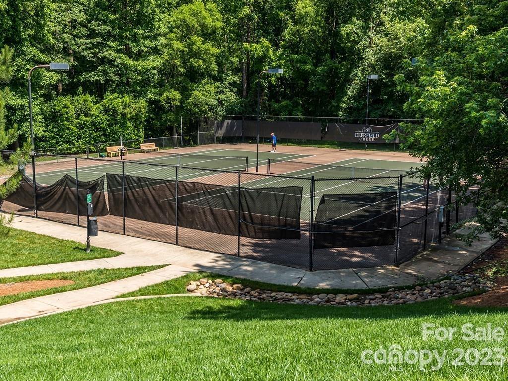 4030 Fawn Hill Road Matthews, NC 28105 - Photo 47 of 48 a view of a backyard with lawn chairs