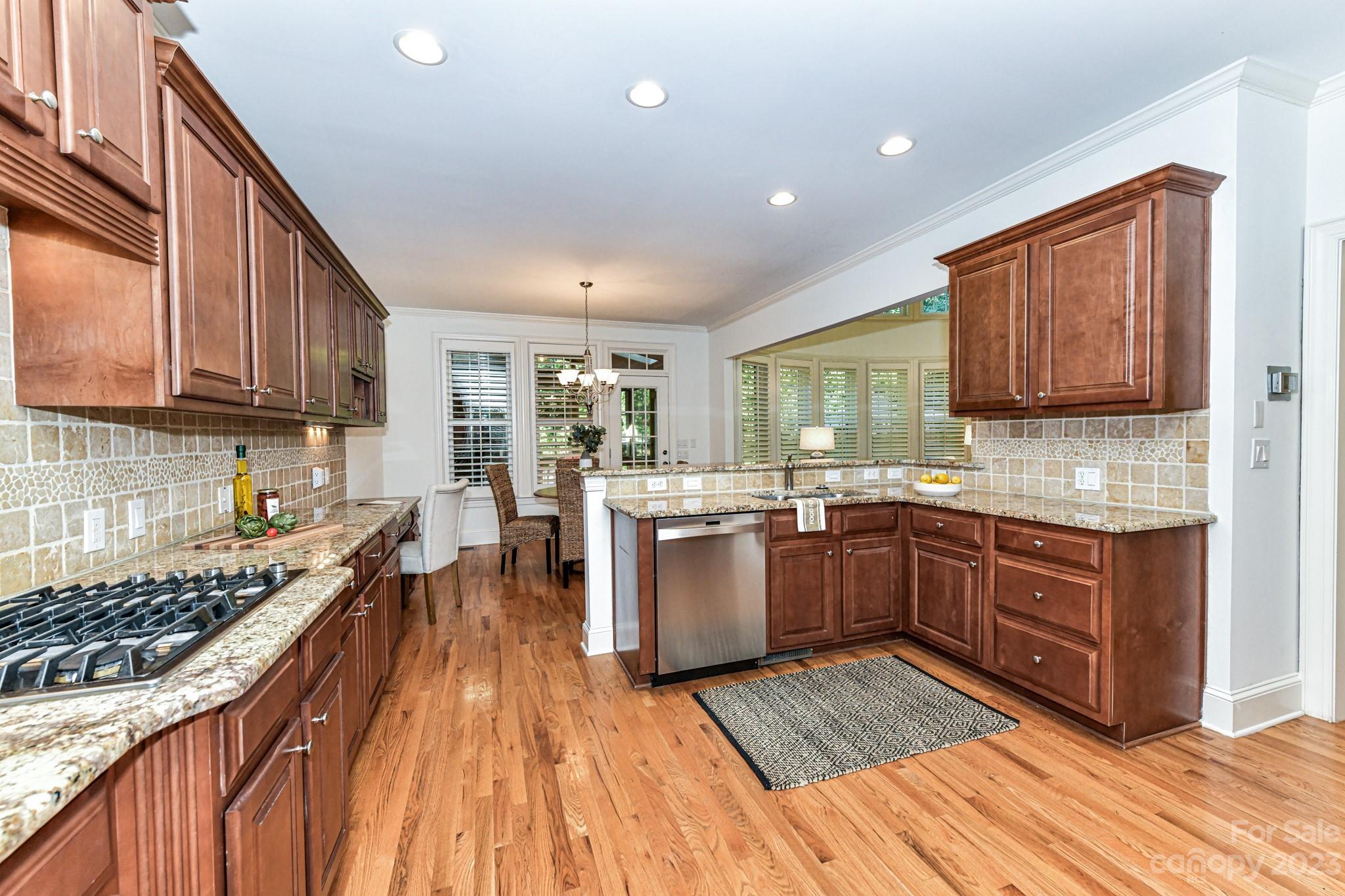 4030 Fawn Hill Road Matthews, NC 28105 - Photo 7 of 48 a kitchen with sink a stove and cabinets