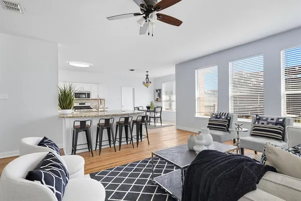 a living room with furniture and a large window