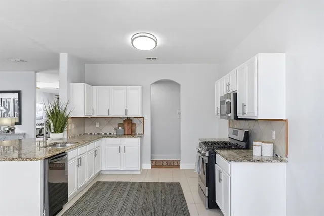 a view of a dining room with furniture and window