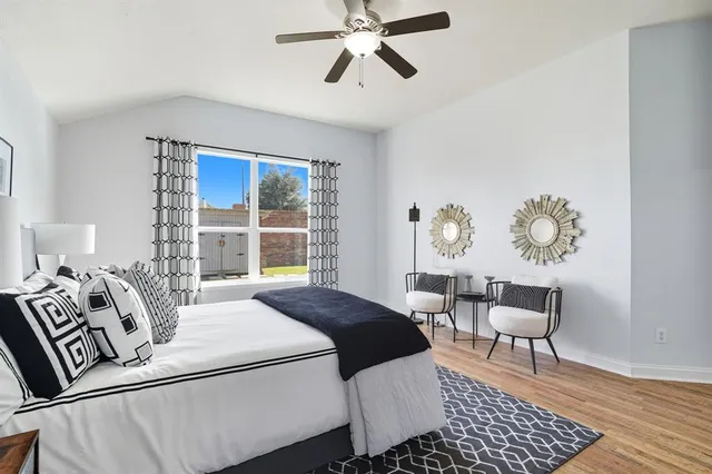 an empty room with closet and ceiling fan