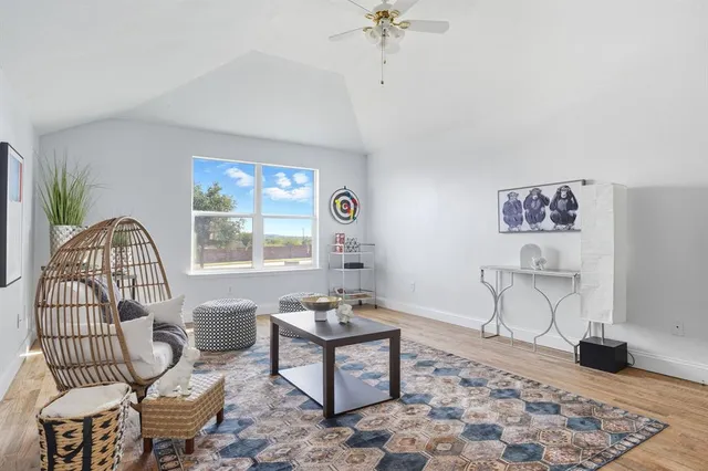 a view of a balcony with wooden floor