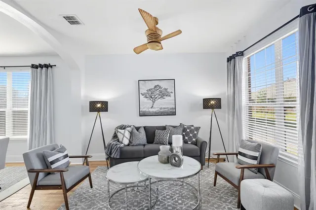a living room with furniture and a large window