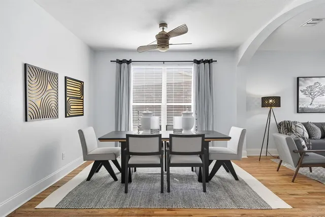 a dining room with furniture and window