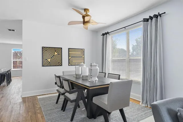 a dining room with furniture and window