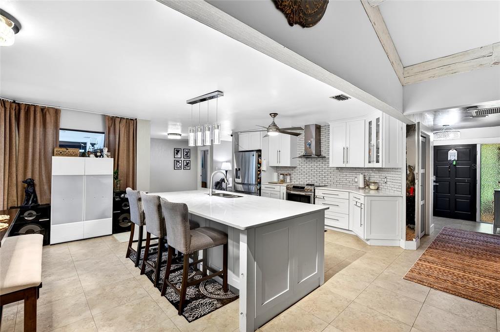 11795 Southwest Highway 484 Dunnellon, FL 34432 - Photo 16 of 51 a large kitchen with a table and chairs in it