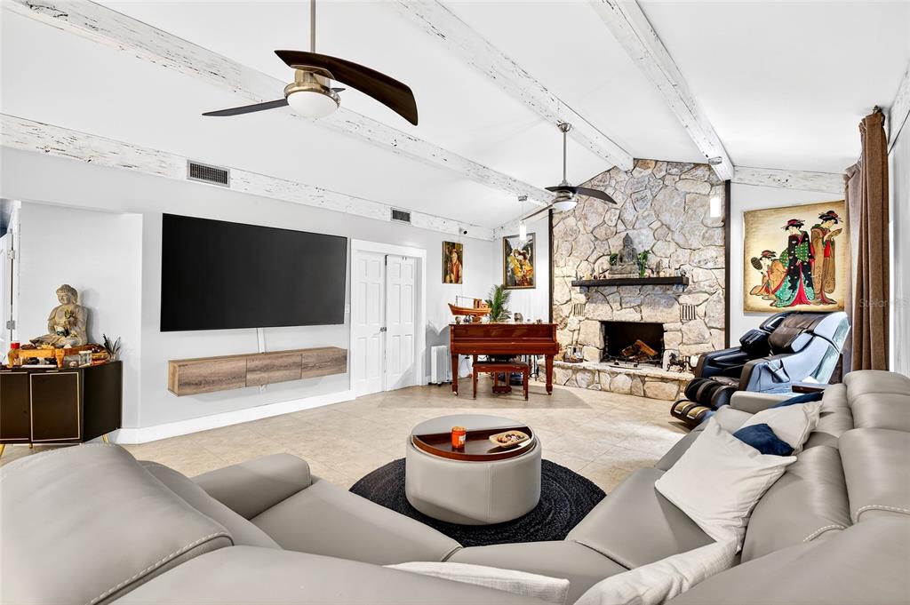 11795 Southwest Highway 484 Dunnellon, FL 34432 - Photo 23 of 51 a living room with furniture and a flat screen tv